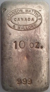 Front of Johnson Matthey and Mallory 10 oz poured silver bar, stamped with circle logo, 10 oz and 999